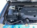 Engine compartment of a 2021 Chevrolet Colorado showing the V6 engine and various components including the air intake and fluid reservoir