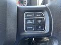 Steering wheel controls of a 2019 RAM 1500 Classic featuring buttons for gear selection and cruise control functions