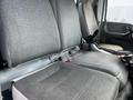 The interior seating of a 2009 Ford LCF 550 featuring two gray upholstered seats with a simple pattern and seat belts visible