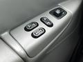 Close-up of the window and door control panel in a 2008 Ford Econoline with multiple buttons for adjusting windows and locks