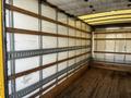 Interior of a 2017 Hino 155 box truck with wooden slats and a wooden floor empty of cargo