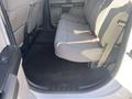 Interior of a 2017 Ford F-150 showing the rear bench seat with gray fabric upholstery and seatbelts