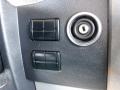 Close-up view of a 2016 Mercedes-Benz Sprinter control panel featuring two black buttons and an ignition lock with a keyhole