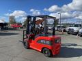 A red 2024 AGT KFE20 forklift with a black cabin and lifting mechanism