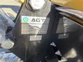 A close-up of a 2024 AGT Mini Excavator displaying the brand logo and specifications label