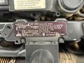 Close-up of a 2020 Genie GTH-5519 machine label showing model number specifications and emission control information