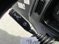 Close-up of a 2012 Autocar Xpert gear shift lever with directional indicators for left and right along with a light control feature