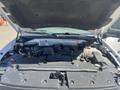 The image shows the engine compartment of a 2013 Ford Expedition with the hood raised revealing various engine components and parts