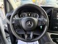 Steering wheel of a 2020 Mercedes-Benz Metris featuring the Mercedes logo and control buttons on the sides