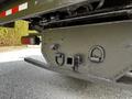 Close-up of the rear undercarriage of a 2015 Mitsubishi Fuso FE showing the hitch assembly and attachment points