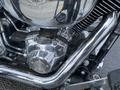 A close-up of the engine of a 2008 Harley-Davidson FLSTFI showcasing chrome components and the prominent V-twin cylinder design