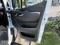 A 2019 Mercedes-Benz Sprinter van door interior showcasing the handle and control panel