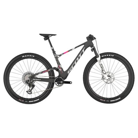 2025 Scott Spark Rc World Cup Evo Mountain Bike featuring a sleek carbon frame black and pink accents and large knobby tires designed for high-performance off-road riding