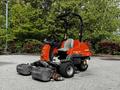 A 2015 Jacobsen Eclipse lawn mower with a compact design features two front cutting decks and a driver's seat with a steering wheel