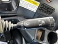 A close-up of the control lever in a 2012 Autocar Xpert showing various settings for windshield wipers including off and on positions