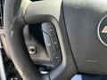A close-up view of the steering wheel of a 2017 Chevrolet Express featuring buttons for cruise control settings including resume set and cancel