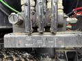 A control panel featuring multiple levers and switches for wash pump vibrator rear door and dump functions on a 2018 Kenworth T800
