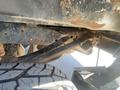Close-up view of the undercarriage of a 2016 Ford F-350 SD showing the frame and suspension components with visible rust and wear