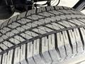 Close-up view of a tire from a 2018 Ford F-150 showcasing its tread pattern and rubber details