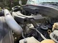 Close-up of the engine compartment of a 2014 International TerraStar showing various components including the air intake and hoses