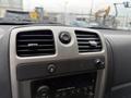 Dash of a 2012 GMC Canyon with air vents and controls for audio and hazard lights visible