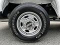 Close-up of a 2017 Ford F-250 tire showing the Firestone Transforce HT tread design and a chrome wheel with a five-bolt pattern