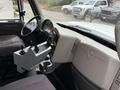 Interior view of a 2012 International 7400 featuring a steering wheel dashboard and control panel with levers and knobs