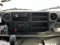 Dashboard of a 2018 Hino 195 featuring audio system controls air conditioning knobs and multiple storage compartments