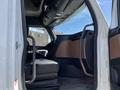 Interior view of a 2022 Freightliner Cascadia showing the driver's seat and dashboard area