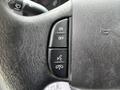 Close-up of the steering wheel controls of a 2018 Ford Econoline showing buttons for on off settings and hands-free communication