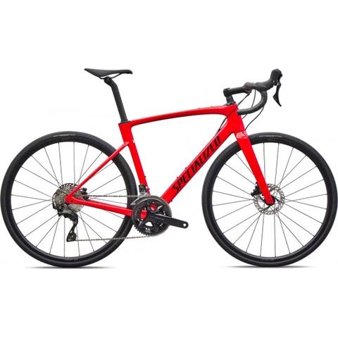 A red 2026 Specialized Roubaix SL8 Sport road bike featuring Shimano 105 components and disc brakes