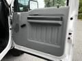 The image shows the interior door panel of a 2011 Ford F-550 featuring a gray design with a handle and controls on the surface