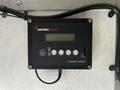 A Samlex power control panel model EVO-RC with buttons for status alarm back up down and enter