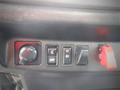 Control panel of a 2014 Hino 308 featuring switches for various functions including a knob for adjusting settings