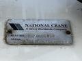 A metal identification plate for a National Crane with part number and serial number details