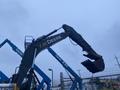 A 2014 John Deere 350G excavator with a large bucket attached to its articulated arm