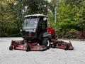 A 2012 Toro Groundsmaster lawn mower with a red and black body features three rotary cutting decks in front for efficient grass cutting