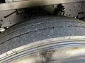 Close-up of a worn tire from a 2006 Emergency One Fire Truck showing visible tread wear and texture