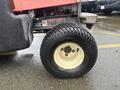 A 2010 Kubota F3680 tractor tire with a black tread and a cream-colored rim