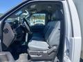 Interior of a 2015 Ford F-450 SD showing a driver's side view with gray seating and dashboard details