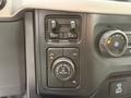 Controls and dials of a 2021 Ford F-150's dashboard including drive mode selector and four-wheel drive settings
