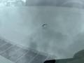 A 2016 Chevrolet Express with a visible hole in the windshield