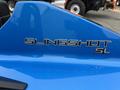 A blue 2020 Polaris SlingShot with the word SLINGSHOT displayed prominently in silver lettering on the side