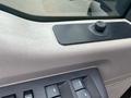 Close-up of the interior dashboard of a 2009 Ford F-450 SD featuring controls and a textured surface near the window