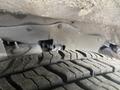 A close-up view of a tire with deep treads belonging to a 2018 Chevrolet Express