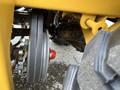 Close-up of the wheel assembly of a 2024 AGT Industrial KRW23 Mini Loader showing the wheel, brakes, and axle components
