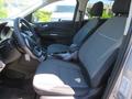 Interior view of a 2015 Ford Escape showcasing the front seats and center console with a focus on the seating design and materials