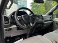 Interior of a 2017 Ford F-250 featuring a steering wheel dashboard and controls