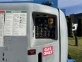 A close-up view of the control panel on a 2012 Genie Z 45/25 featuring various buttons switches and labels including a prominent gas only sticker