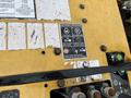 Close-up of a 2014 Vermeer Corporation Sweep Stump Cutter control panel showing shutdown procedure instructions and operational controls